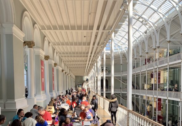 Internal shot of people sitting down at the tables in the Café