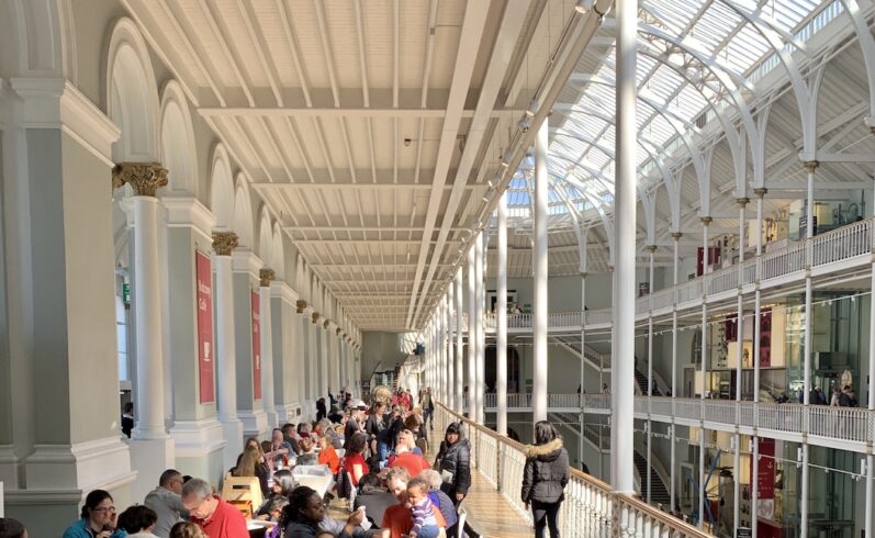 Internal shot of people sitting down at the tables in the Café