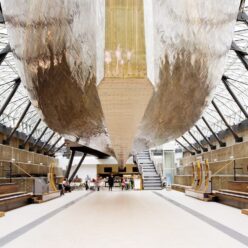 People sitting at tables in the main hall