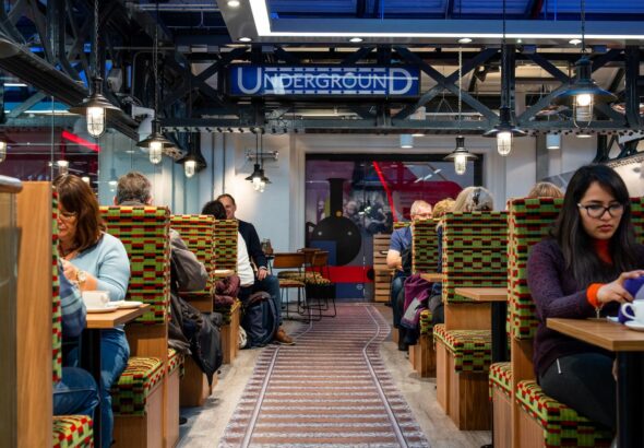 A photo showing people sitting in booths in the Café