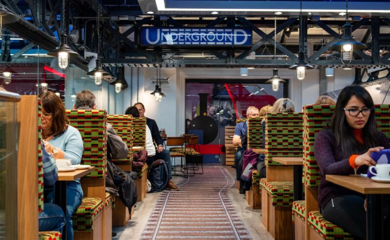 A photo showing people sitting in booths in the Café