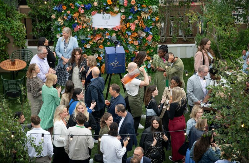 a networking standing reception event on a rooftop
