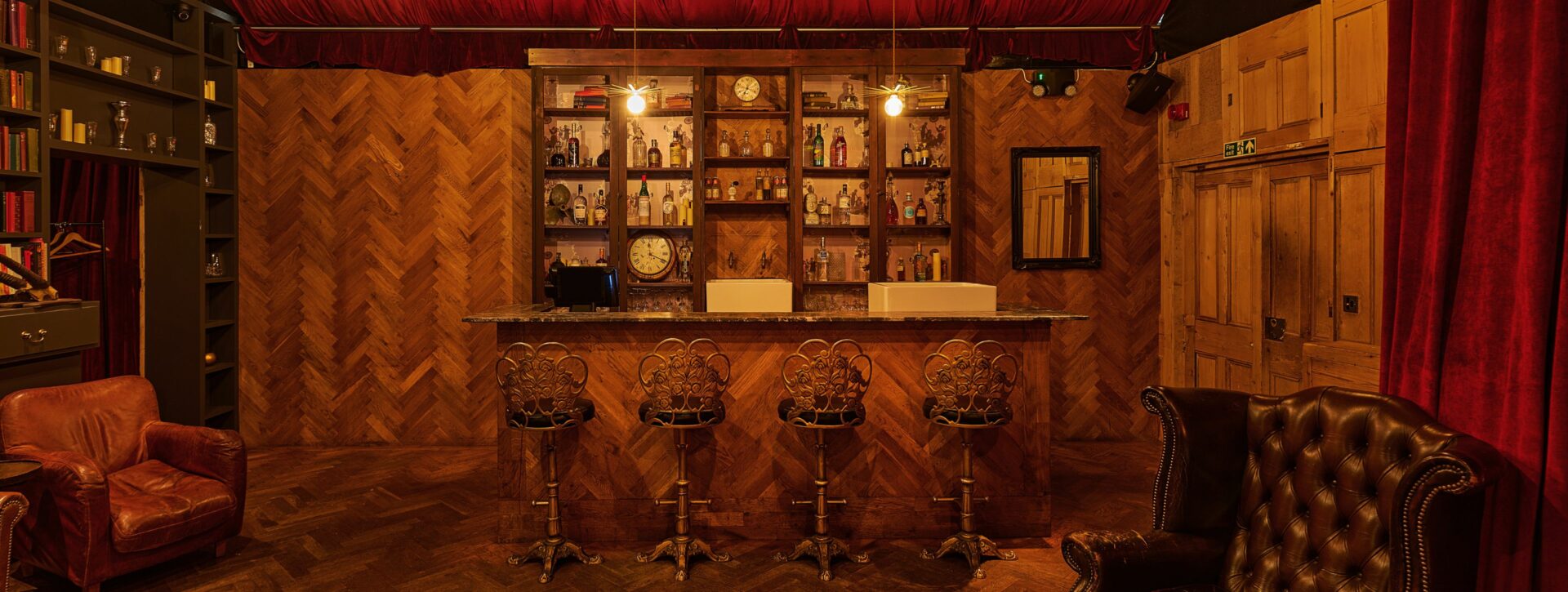 The Drawing Room at the BFI Southbank - A wooden clad bar with high streets in an apothecary style room